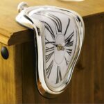 Surreal melting clock wall decor with distorted face and Roman numerals, inspired by Salvador Dalí's art, perfect for science-themed or artistic interior decoration.