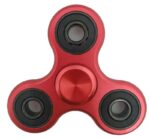 Fidget spinner toy with a red body and three black bearings, designed for stress relief and focus enhancement. Compact, portable, and popular among students and adults for relaxation and concentration.