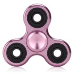 Pink metallic fidget spinner with three arms and black circular bearings, designed for stress relief and focus enhancement.