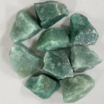Natural green mineral stones with rough texture, ideal for science decor and learning activities.
