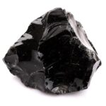 Smooth black obsidian crystal rock, used for healing, protection, and spiritual growth, displayed on a white background.
