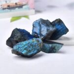 Natural blue labradorite mineral stones with iridescent blue and green hues, perfect for educational displays, science decor, and gemstone collections.