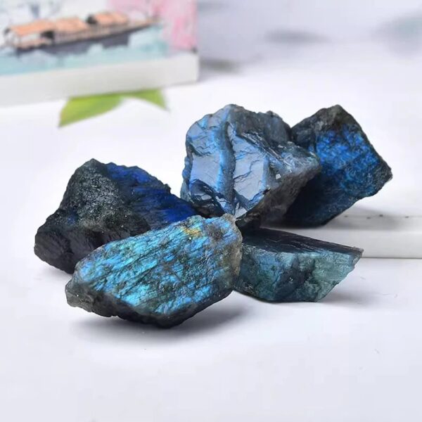 Natural blue labradorite mineral stones with iridescent blue and green hues, perfect for educational displays, science decor, and gemstone collections.