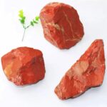 Three polished red jasper stones with natural patterns, used for science experiments, educational displays, and decorative purposes.