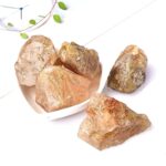 Natural pink Himalayan salt rocks displayed on a white surface, ideal for science decor and educational purposes.