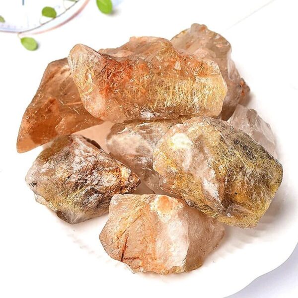 Natural golden quartz crystal rocks with shimmering golden inclusions, ideal for healing, meditation, and decorative purposes.