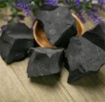 Black obsidian mineral specimens for educational and decorative purposes.
