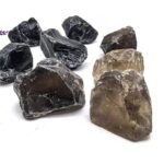 Assorted raw mineral rocks including black and brown stones, ideal for science experiments, educational displays, and decorative science decor.