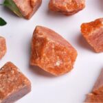 Natural Himalayan salt rocks with a pink-orange hue, ideal for educational displays and science projects.