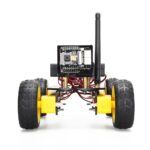Small robotic car with wireless communication module, sensors, and yellow wheels, designed for educational STEM projects and robotics learning.