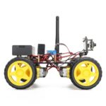 Small remote-controlled car with antenna, electronic circuit, and wiring, showcasing a DIY robotics project for educational purposes.