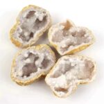 Amethyst geode crystals with purple and white crystalline interiors and rough outer surfaces.