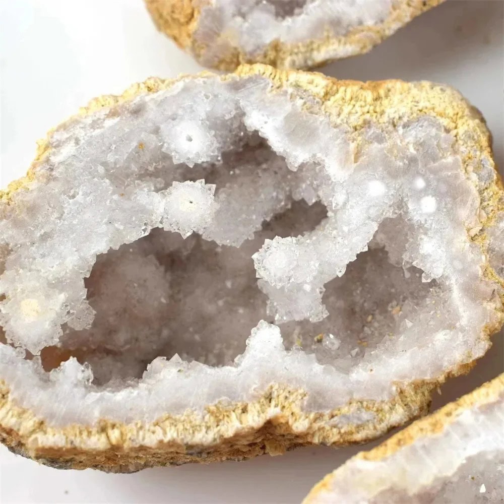 Geode Mineral Specimen Close-up of a sparkling geode with crystalline interior and rough outer surface, showcasing natural mineral formations.