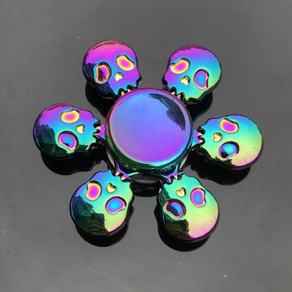 Bright rainbow-colored skull and circle fidget toys for stress relief and sensory play.