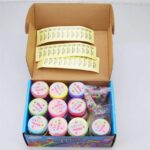 Brightly colored slime kits with multiple containers and sprinkles for creative science experiments.