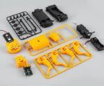 Educational mini robot kit with cat face design, motors, and electronic components for STEM learning and robotics projects.