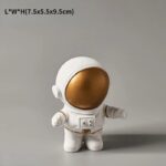An adorable astronaut plush toy with a white suit and gold helmet, designed for science lovers and educational decor. Ideal for children, classrooms, or as a gift for space enthusiasts, bringing a fun.