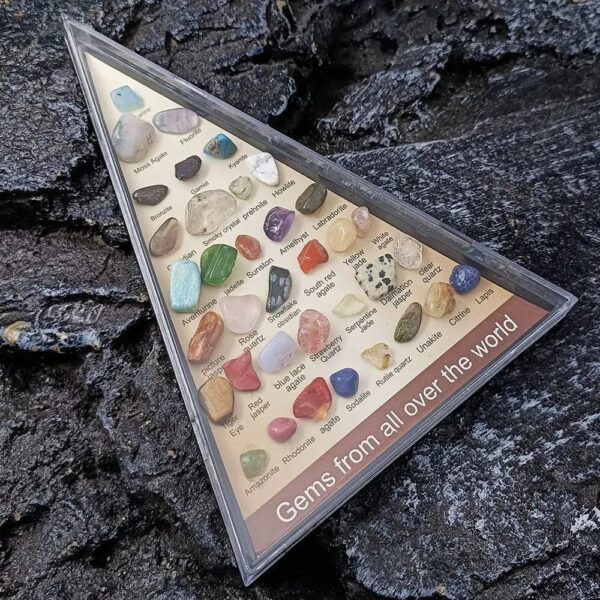 Colorful collection of various gemstones in a display case.