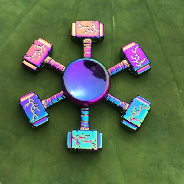 Colorful magnetic science toy with six interconnected pieces on a green leaf background, designed for educational play and STEM learning.
