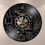 A physics-themed wall clock featuring scientific symbols, formulas, and illustrations related to physics, perfect for science enthusiasts and educational decor.