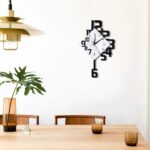 Stylish modern wall clock featuring a unique geometric design with black and white elements, perfect for contemporary home decor.