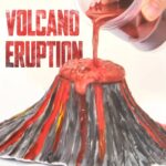 Realistic volcano eruption model with flowing red lava and detailed volcanic structure, ideal for educational science demonstrations and classroom decor.