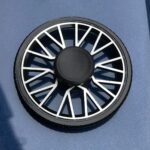 A magnetic levitation spinner toy demonstrating magnetic repulsion and levitation principles, with a circular design and a central black magnet.
