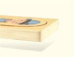 Wooden puzzle with cartoon character illustration.