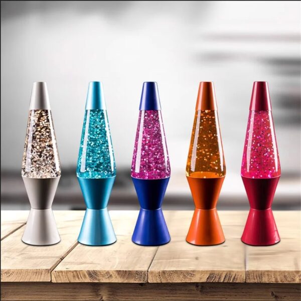 Colorful lava lamps with glittery liquid in various shades including silver, blue, pink, orange, and red, displayed on a wooden surface.