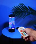 Color-changing jellyfish aquarium with remote control in a modern setting.