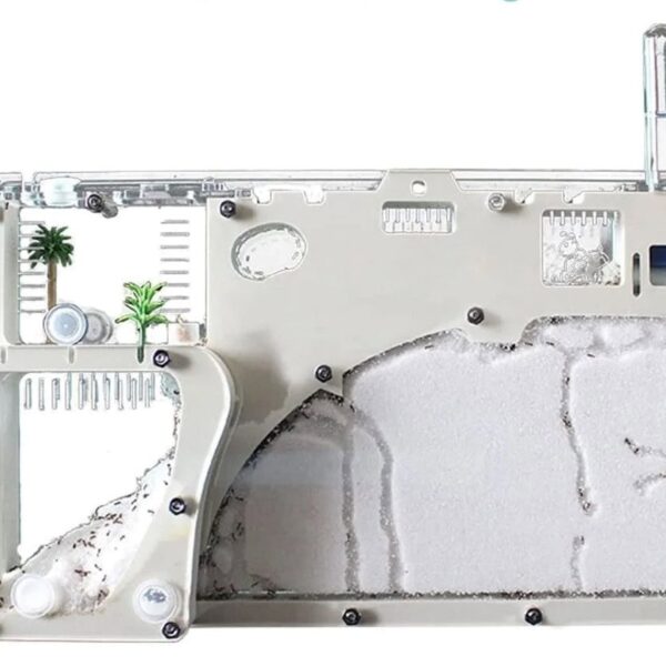 Miniature scientific experiment setup with transparent components and white textured surfaces.