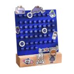 A colorful educational calendar toy with days, dates, and months, featuring cute illustrations of animals and objects, designed for teaching children about time and dates.