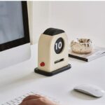 Vintage-style mechanical desk timer displaying "10" minutes, ideal for time management, study sessions, and productivity enhancement in modern workspaces.