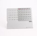 White desk calendar with magnetic markers for easy date tracking and planning, ideal for educational settings and home offices.