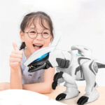 Young girl with glasses smiling and giving a thumbs-up next to a robotic dog toy, showcasing a fun and educational science gadget for children.