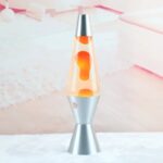 Modern lava lamp with orange wax inside a clear glass tube, silver base and cap, creating a relaxing visual effect. Perfect for science-themed decor and educational purposes.
