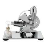 A miniature steam engine model demonstrating steam power with a glass container, metal components, and a small boiler.