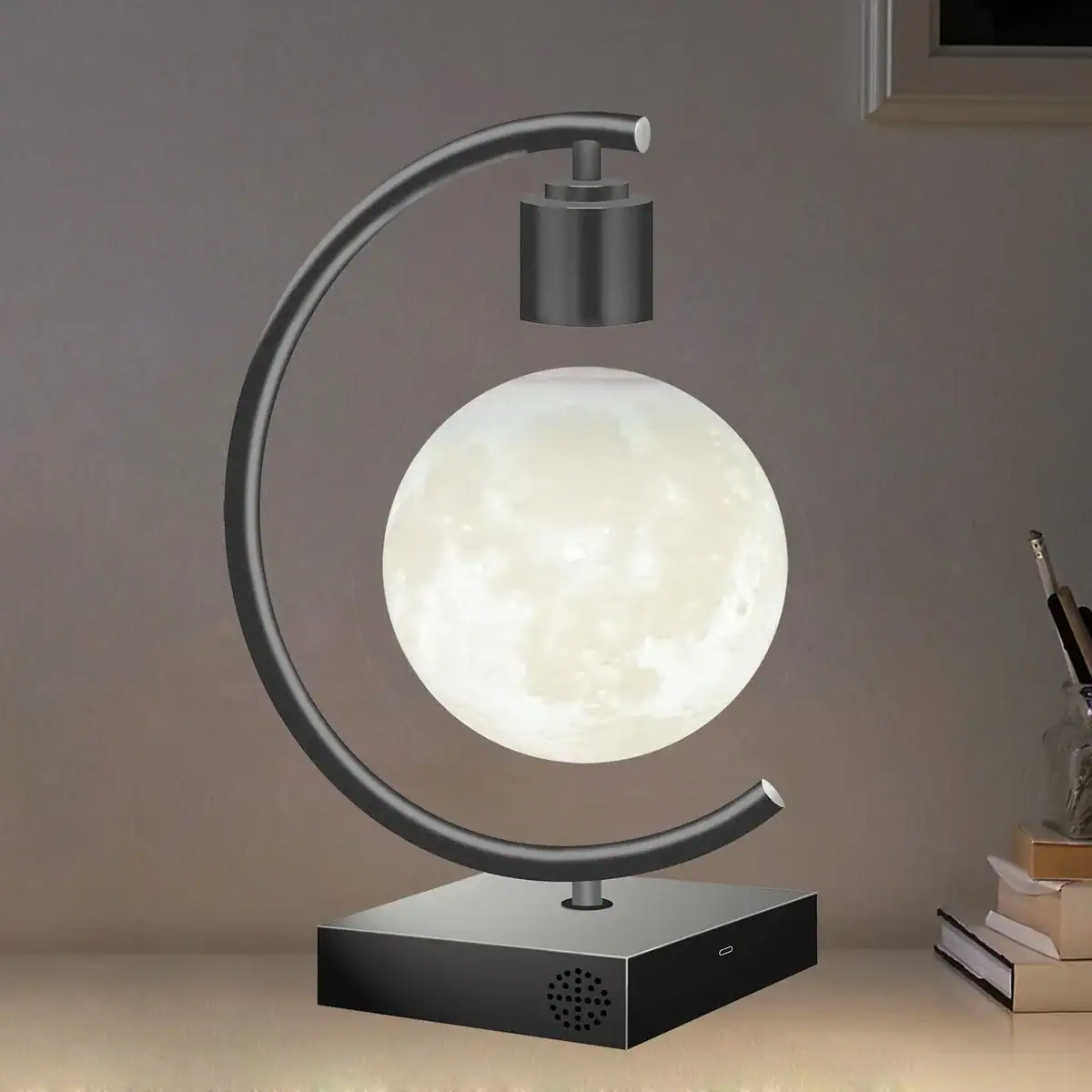 Moon Lamp with Adjustable Metal Arm Modern moon lamp with a spherical, moon-like glow, mounted on a sleek black base with an adjustable metal arm for versatile lighting angles.
