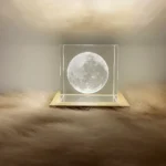 A 3D moon-shaped LED night light encased in a clear acrylic cube, creating a realistic lunar illusion. Perfect for space-themed decor and educational purposes.