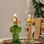 Antique-style oil lamps with glass reservoirs and brass accents, perfect for science decor and educational displays.