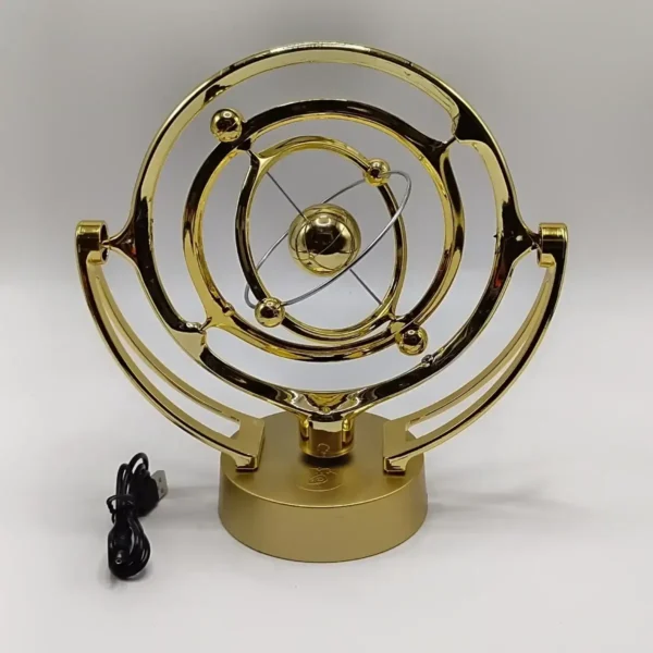 A decorative atomic model-inspired desk lamp with a gold finish, featuring orbiting spheres representing electrons around a central nucleus, perfect for science enthusiasts.