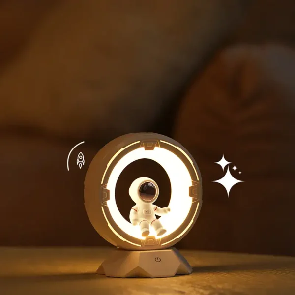 LED night light featuring a cute astronaut figure inside a circular frame, ideal for space-themed decor and educational purposes.