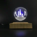 Modern plasma globe with LED lightning inside a glass sphere, mounted on a wooden base, creating a captivating visual display.