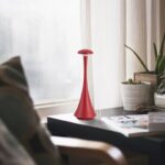 Red science-themed decorative object on a windowsill.