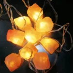 Warm yellow salt rock string lights for cozy ambiance and decorative lighting. Perfect for home decor, parties, or educational displays.