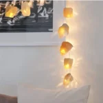 String lights featuring rock-shaped covers, creating a warm and inviting ambiance perfect for home decoration or relaxing spaces.