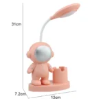 Cute astronaut desk lamp with adjustable light and space-themed design, perfect for science enthusiasts and educational settings.