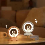Astronaut LED Night Light with Circular Frame, White and Rose Gold Colors.