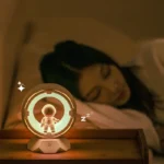 Night light featuring a cute astronaut figure inside a circular frame, emitting a soft glow ideal for children's bedrooms or science-themed decor.