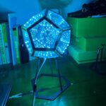 LED geometric lamp with blue lights, perfect for science-themed decor and educational spaces. Features a dodecahedron shape with intricate LED patterns, creating a modern, scientific ambiance.